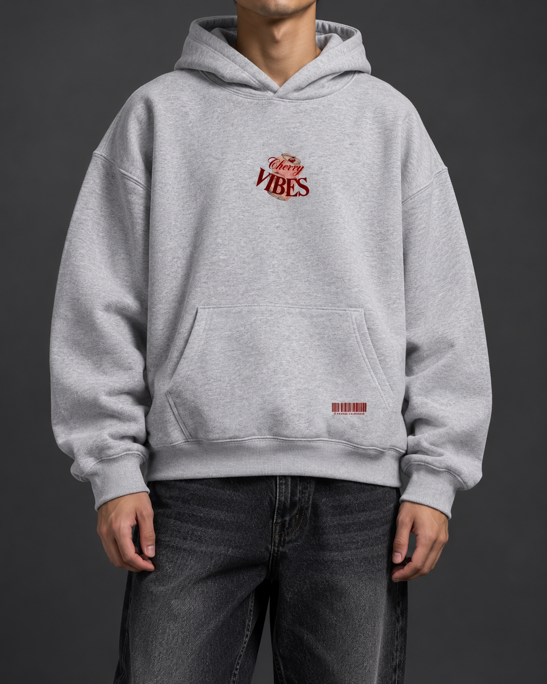 Cherry Vibes grey oversized hoodie — model front on charcoal studio background