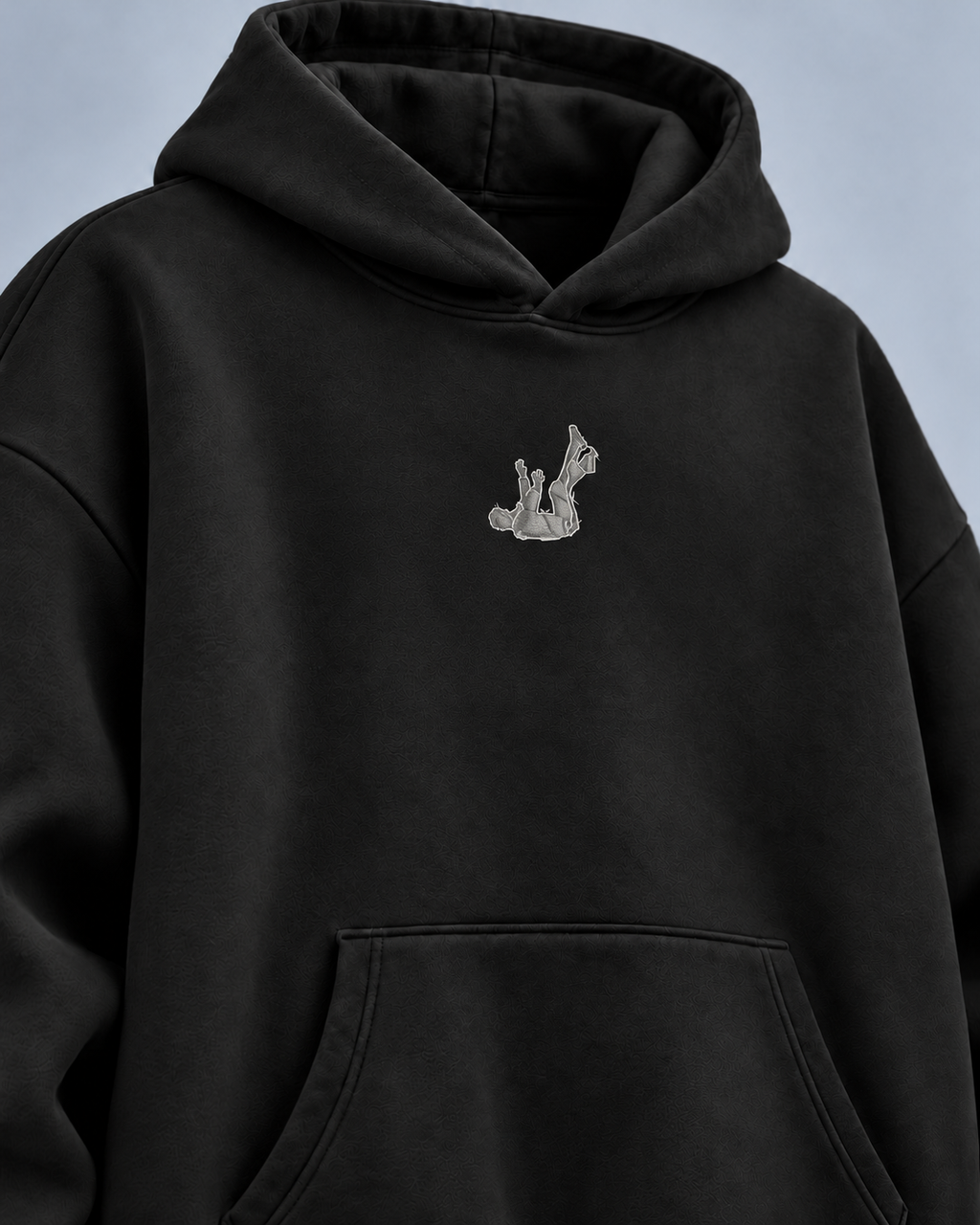 Fallen Desire black hoodie — front detail on light grey studio background