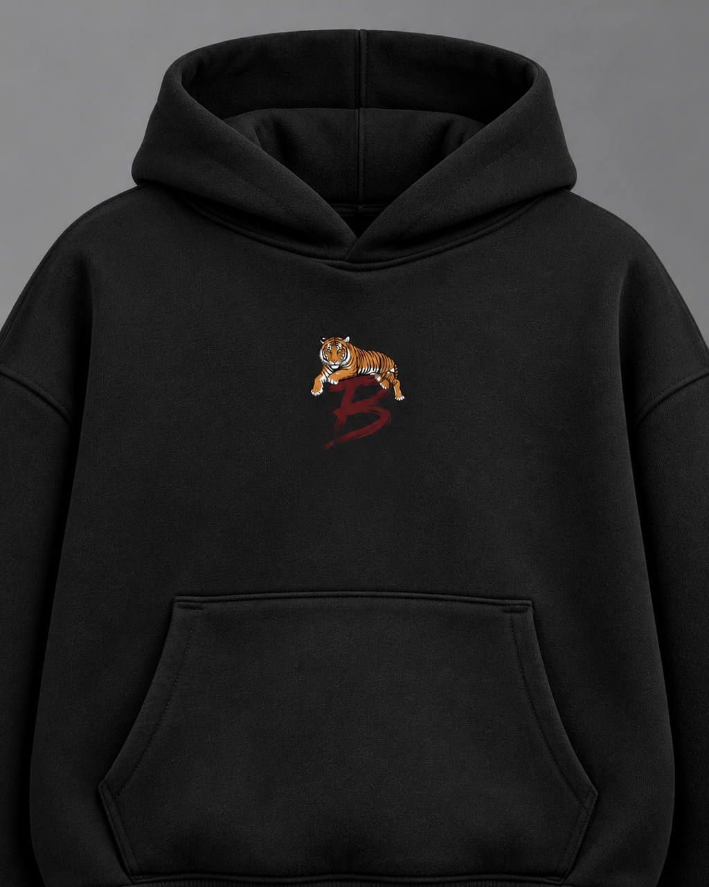 Tiger Crest oversized hoodie — black detail studio photograph