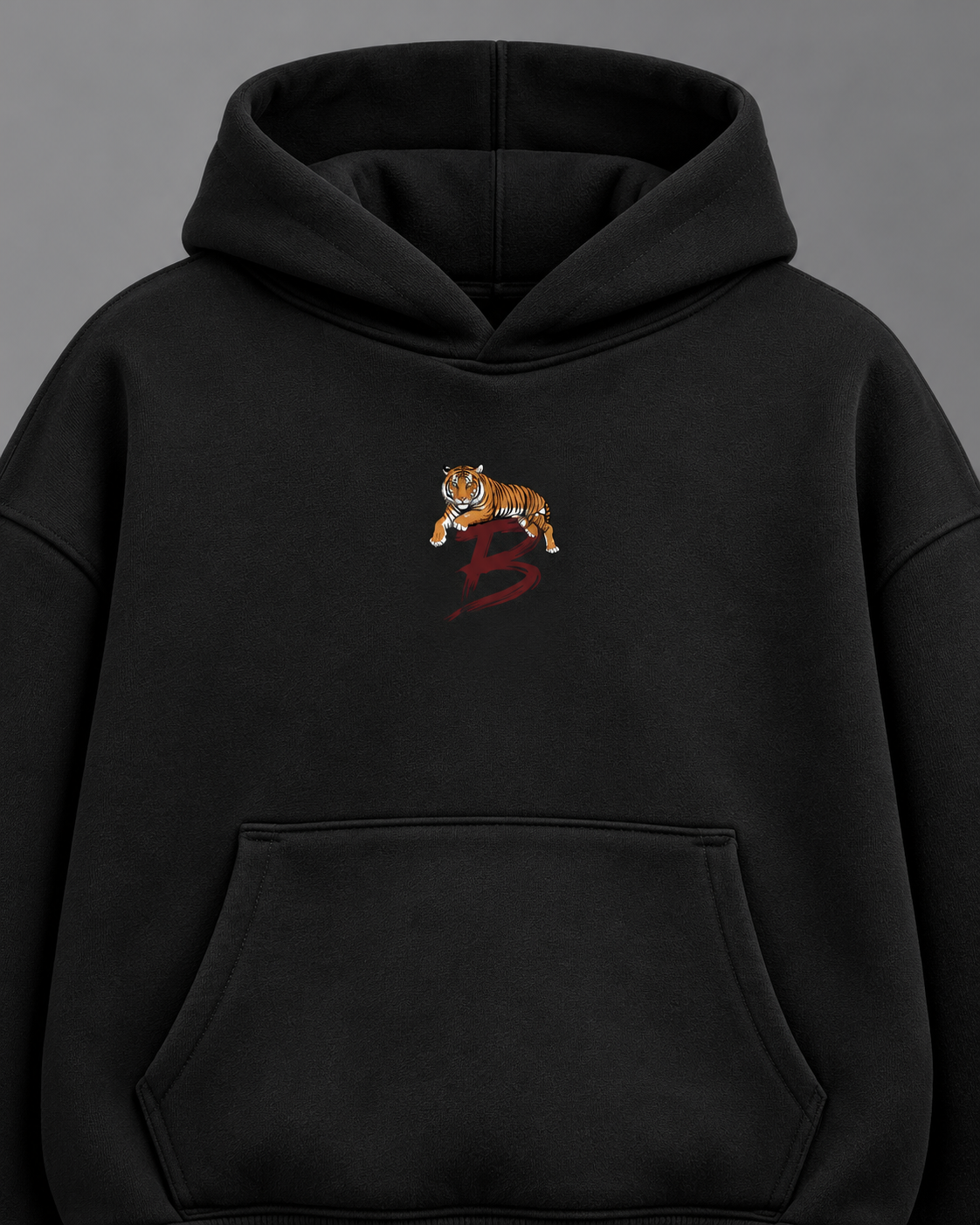 Tiger Crest oversized hoodie — black detail studio photograph